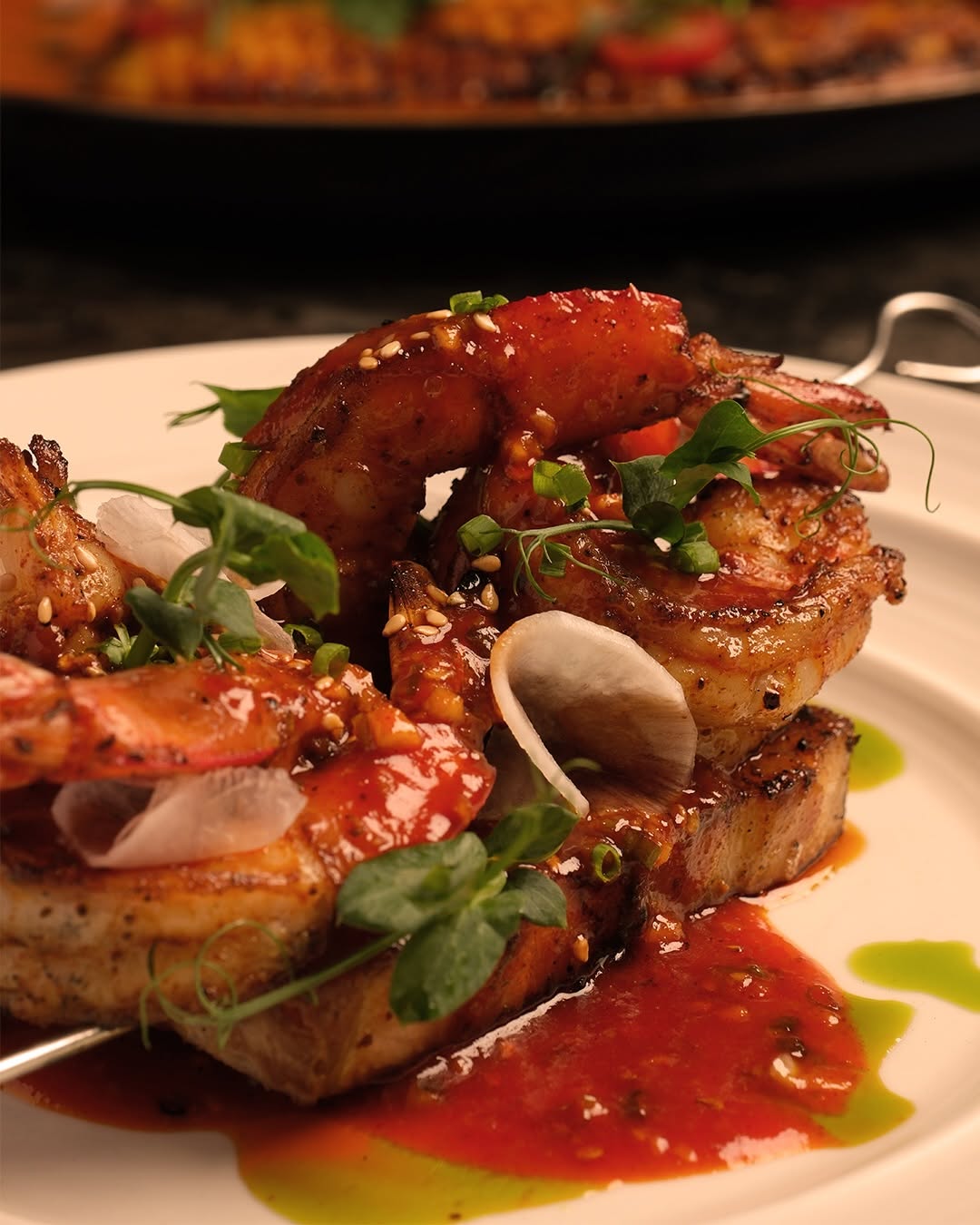 Prawn skewer on white plate